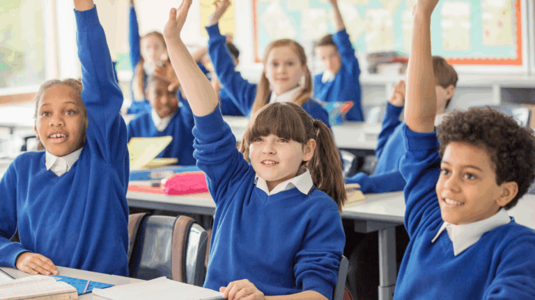 Children answering questions in class